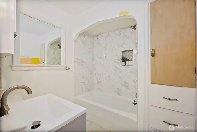 2nd main floor Full Bathroom with ample storage, located at end of hallway