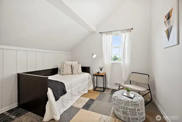 Upstairs third bedroomwith vaulted ceilings - flexible options for play space, hobby room, home office and more.