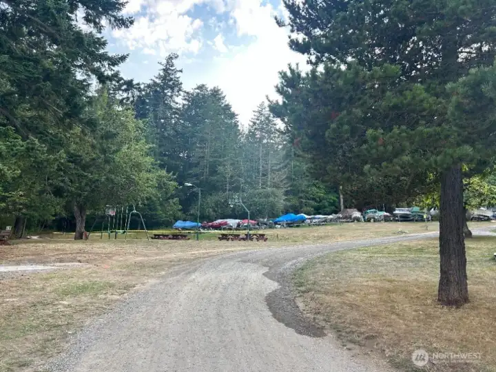 Recreation area and boat storage in the background.