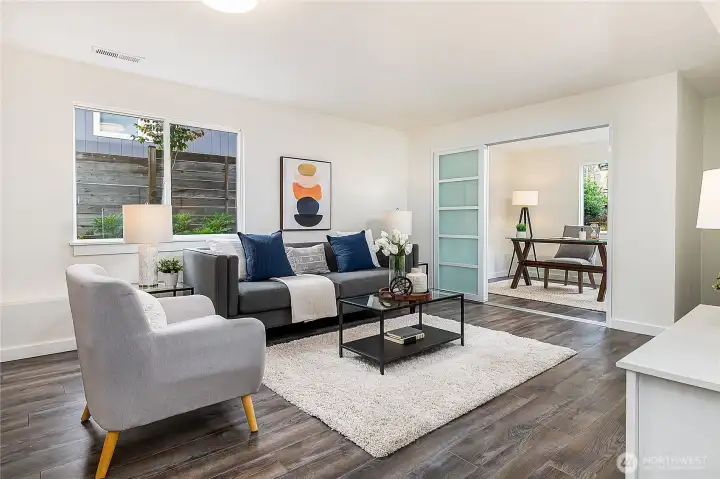 Lower level family room is super spacious and gets great natural light. Tri-fold sliding doors close off the office / den for work from home privacy. This 5 bedroom + additional den makes this home very flexible for many types of use. Plenty of space for a home gym, multiple offices, etc.