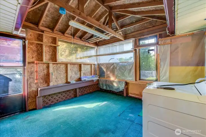 Enclosed porch area for more storage, or a sitting room