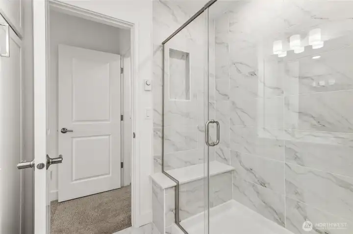 Primary bathroom suite. Features and colors may vary.