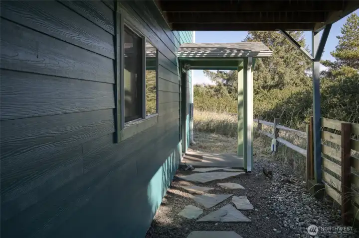 Side Entrance and Fenced Back Yard