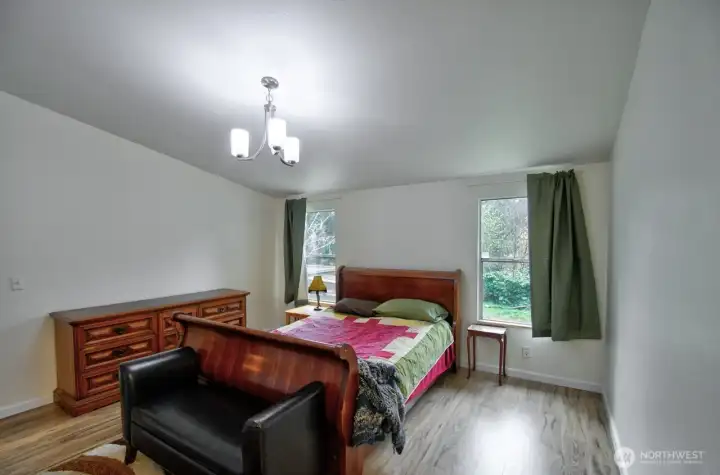 Large primary and en suite with soaking tub and separate shower.