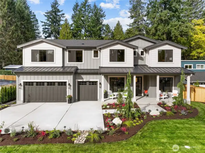 Hamish Anderson Custom Homes presents a one-of-a-kind NW Modern Craftsman in north Rose Hill. Expansive homesite with approx. 9,932 sq. ft., absolutely charming extended covered front porch, and a three-car garage.