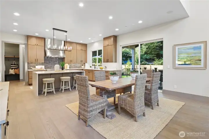 Large kitchen, tons of storage, deep pull-out drawers for pots, pans, and serving trays. In-island microwave and bonus cabinets on the back side of the island. Gorgeous island chandelier. Spacious everyday dining.