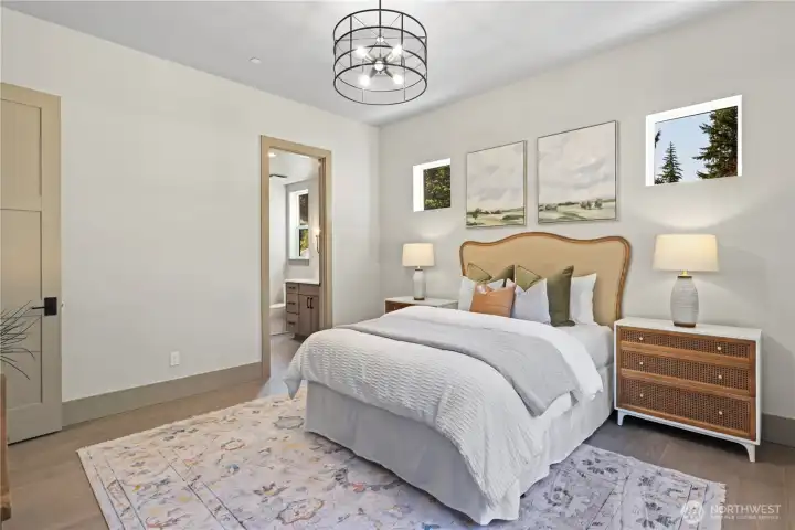 Spacious main floor guest suite with private bathroom and a walk-in closet.