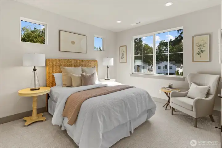 A secondary upper-level bedroom large enough for a queen or king size bed plus two large nightstands, and a desk or dresser plus walk-in closet.