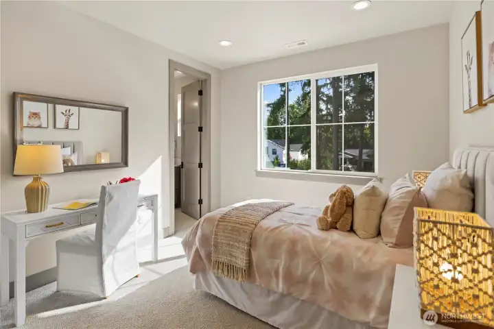 Another ensuite bedroom located on the upper floor. Southerly light makes this room bright and cheerful. Extra-large walk-in closet.