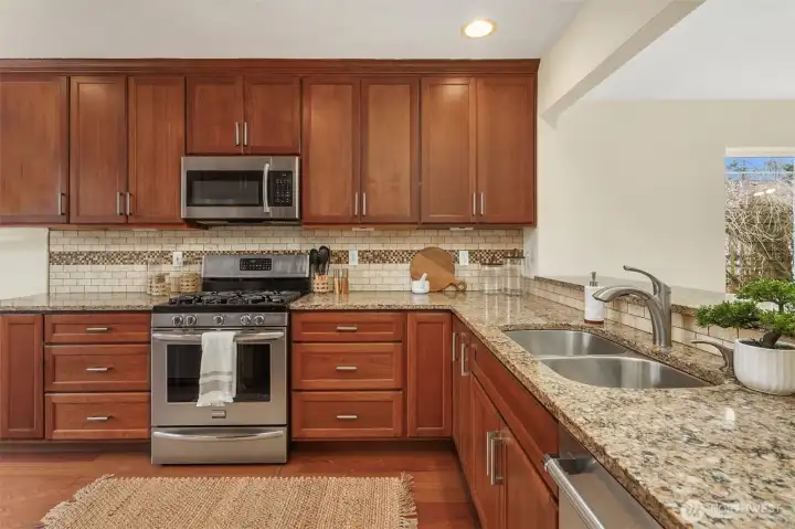 Quartz counters & stainless appliances.