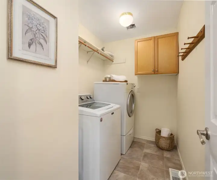 Laundry room with storage.