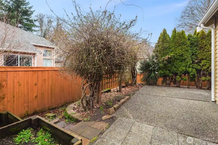 Fully fenced private patio backing to a protected natural area.