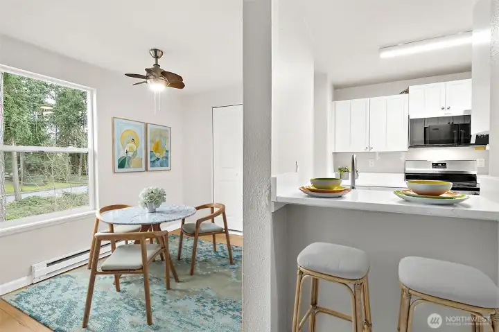 Virtually staged dining room and casual eating bar at