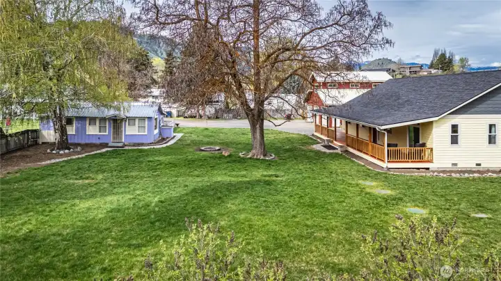 Almost an acre of level, fully fenced, level land with lots of room for gardening, a horse, dogs, parties, lawn games, & entertaining, or just enjoying the privacy of your oasis!