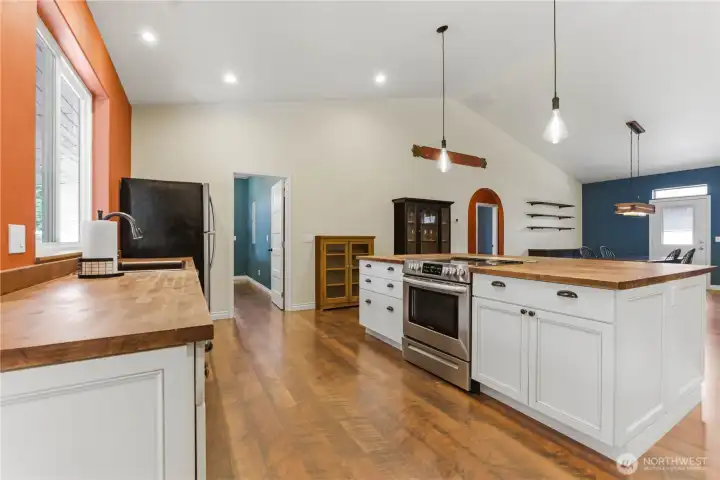 The kitchen is just to the left of the front door as you enter, & there's another entrance to the left through the Utility room.