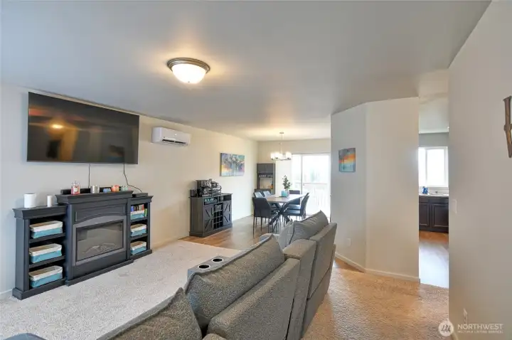 Top of stairs looking into living room dining room and kitchen.