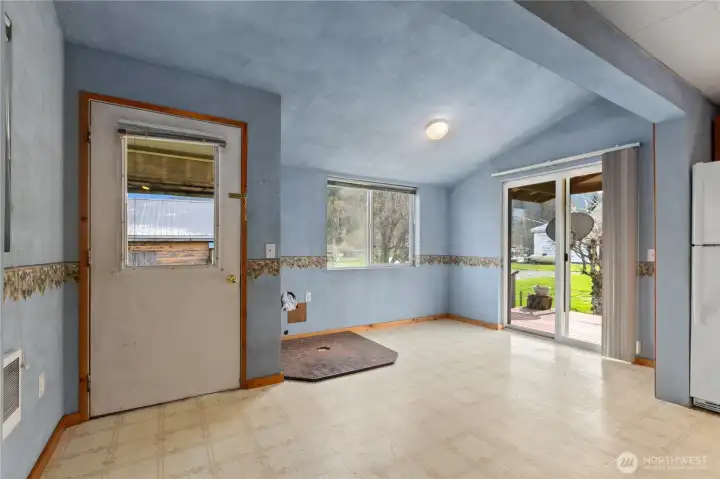 Dining area with slider to covered deck, perfect for BBQing