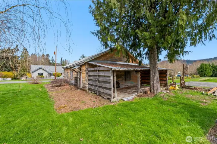 Additional covered storage/wood shed off the garage