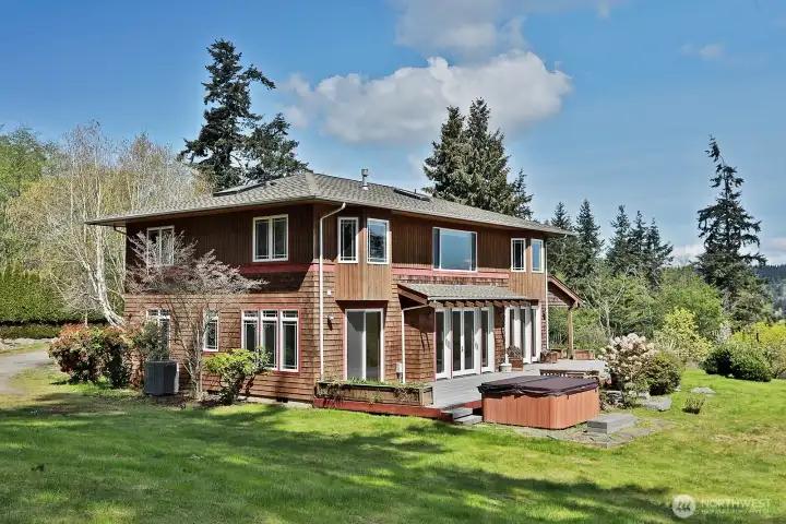 There is an entertainment sized deck with hot tub for outdoor living and entertaining!