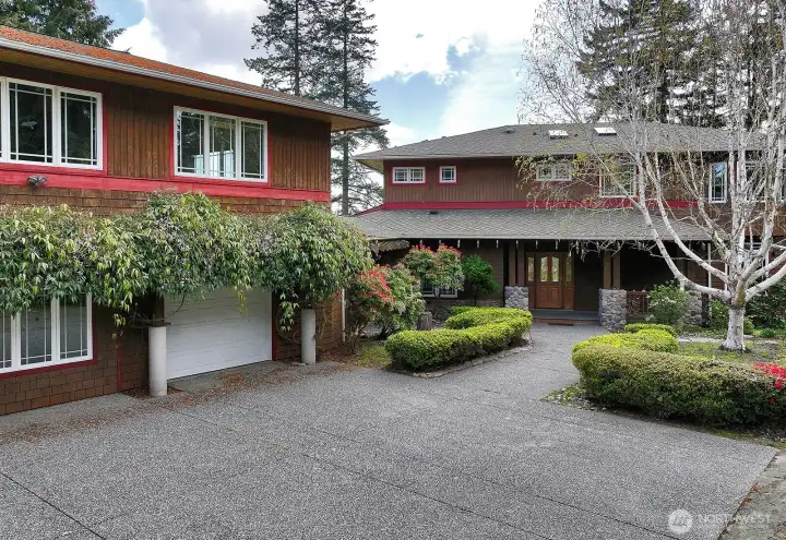 Easy walk in from the off street parking area. Several cars can fit in front of the garage building and there is another off street parking spot to the right of the house for guest house parking.