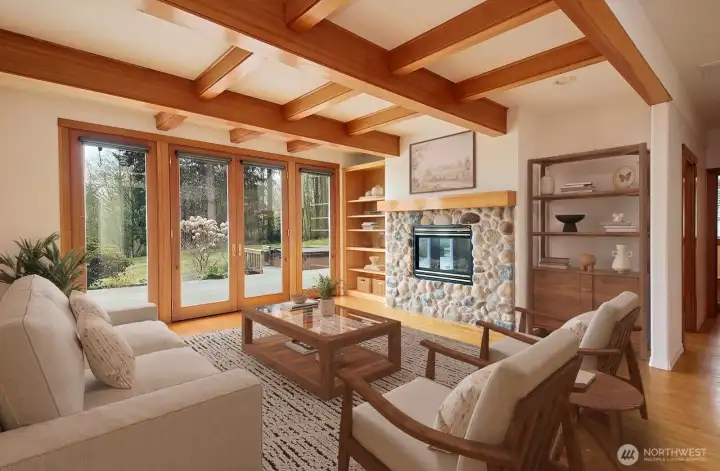 As you come inside the wall of windows greet you bringing the outside in.  Virtually Staged.