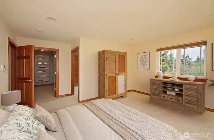 There is a huge walk in closet and 3/4 bath with double sinks.  Virtual staging.