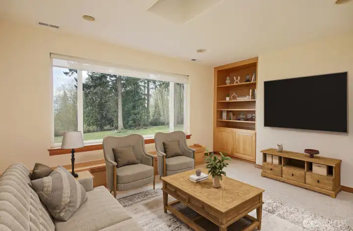 Bonus room upstairs enjoys the view and has been used as a tv room in the past.  Virtual staging.