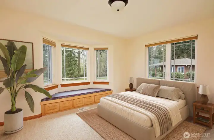 Upstairs rooms used as bedrooms have window seats for storage.  This room on the view side of home does not have a closet so technically not a bedroom.  Virtually staged.