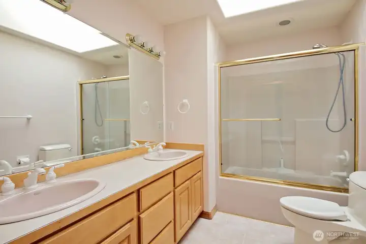 Hall bath is a full bath with double sinks.
