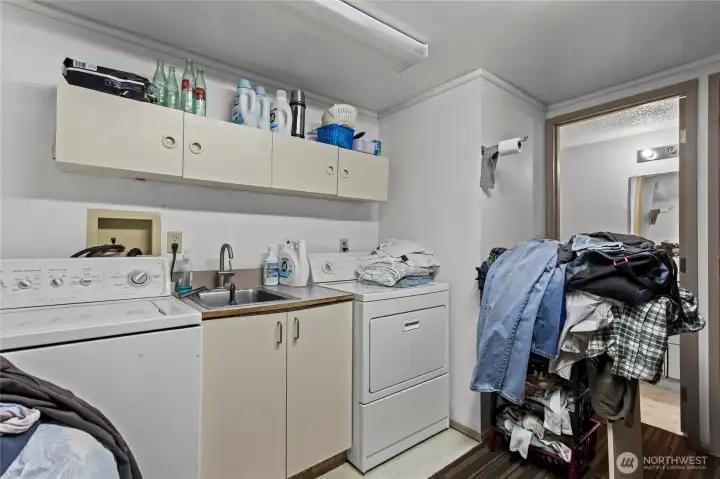 Laundry space downstairs with 3/4 bath