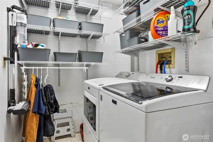 Roomy laundry room with plenty of storage Roomy laundry room with plenty of storage