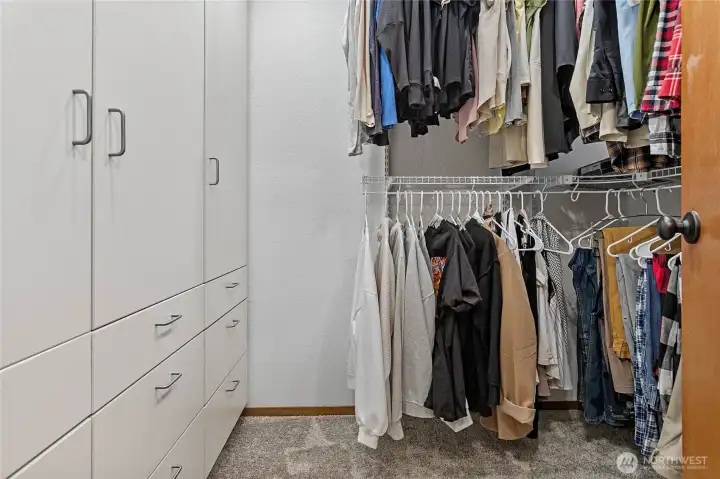 Primary walk in closet with custom closets Primary walk in closet with custom closets