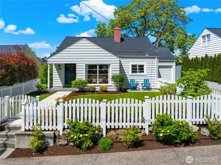 Beautiful level-entry Cape Cod with timeless curb appeal and classic white picket fence in this sought-after Magnolia neighborhood.