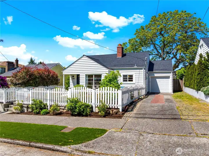 Additional features include attached one-car garage, heat pump with A/C, ample storage, and extensive system updates in 2021 including windows, plumbing, electrical, roof, and insulation.