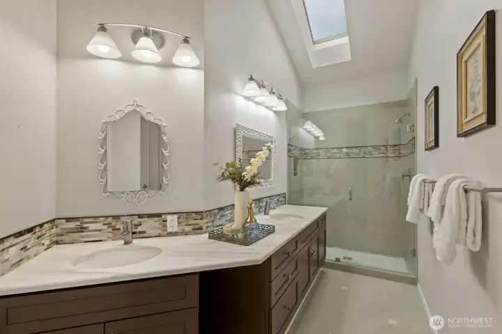 The remodeled primary bathroom is so chic! You'll feel like you're at the spa every day. The remodeled primary bathroom is so chic! You'll feel like you're at the spa every day.