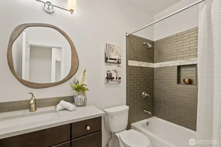 Full remodeled bathroom off of the hallway, perfect for guests. Full remodeled bathroom off of the hallway, perfect for guests.