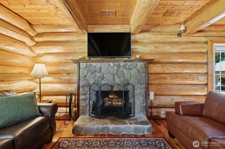 River rock fire place with vents above for upstairs heat & return. River rock fire place with vents above for upstairs heat & return.