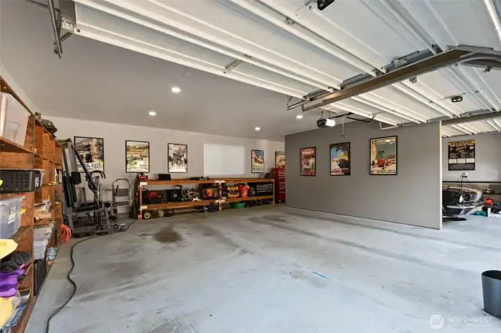 Garage interior with can light bench and storage, super clean! New doors too. Garage interior with can light bench and storage, super clean! New doors too.