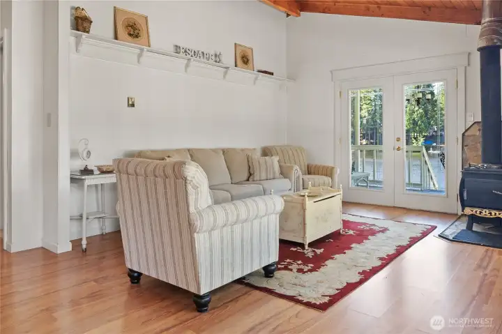Great room with fireplace and french doors.
