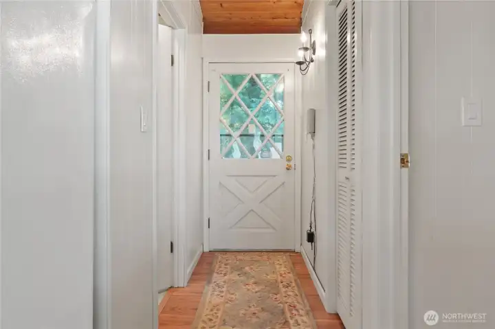 Hallway leads to the back door, step down and to your side yard.