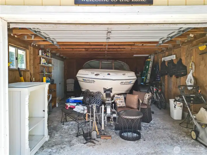 Garage with boat in it, could be your car, or a workshop.
