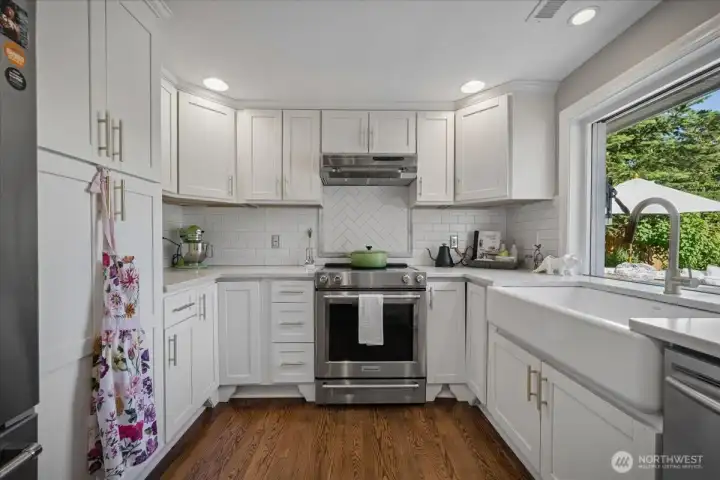 Remodeled kitchen with quartz counters & Nano window