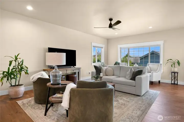 Bright and open living room with a warm and inviting color scheme.
