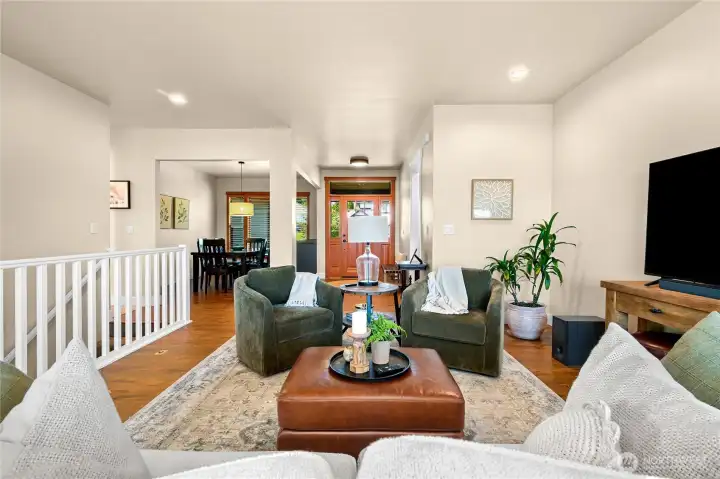 Great room with front entrance, dining area and living room.