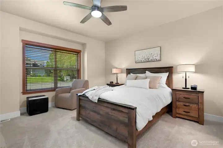 Spacious primary bedroom with lots of space for furniture and reading nook.
