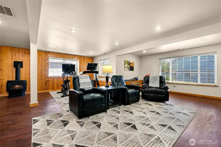 Ample size living room that has space for multiple uses including entertainment area, exercise equipment and much more.