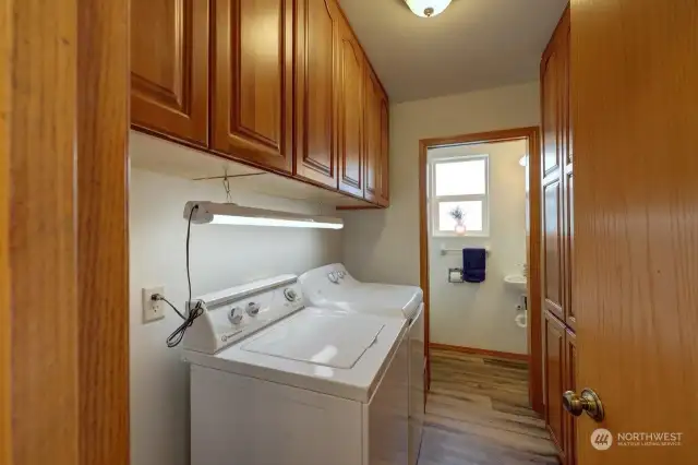 Laundry room off kitchen and garage area