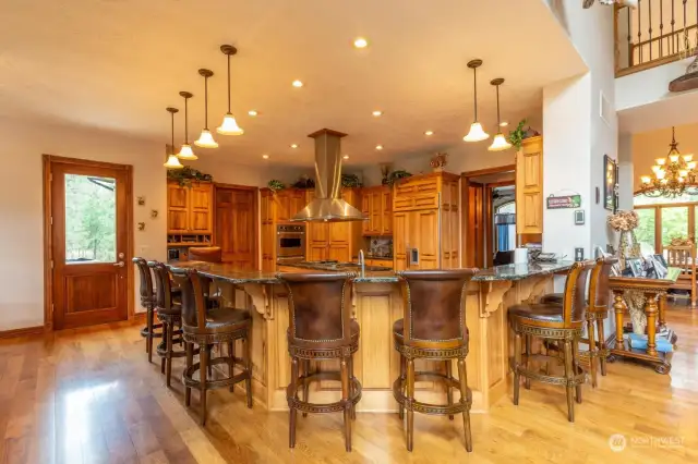 Large kitchen with eat-in bar. Room for everone to gather.