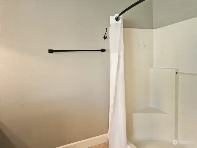 ncredible primary bathroom with a huge walkin shower.
