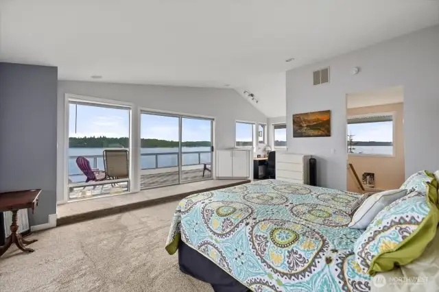 PRimary BR - waking up to views of water and Mt Rainier! Or having a glass of wine or cup of coffee on your private deck.